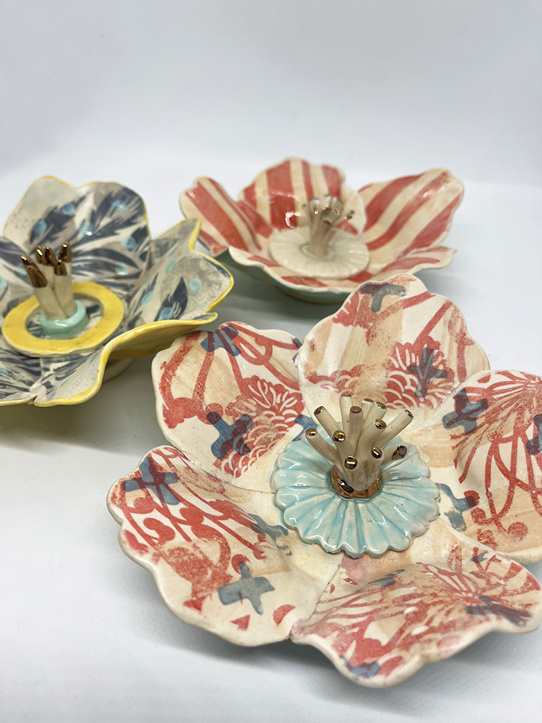 Hand-painted ceramic flower forms with gold-tipped stamens