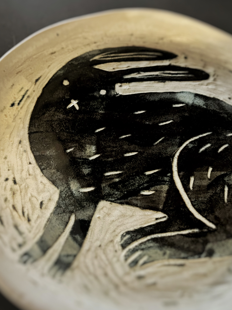 Ceramic plate with charcoal illustration on a warm cream glaze